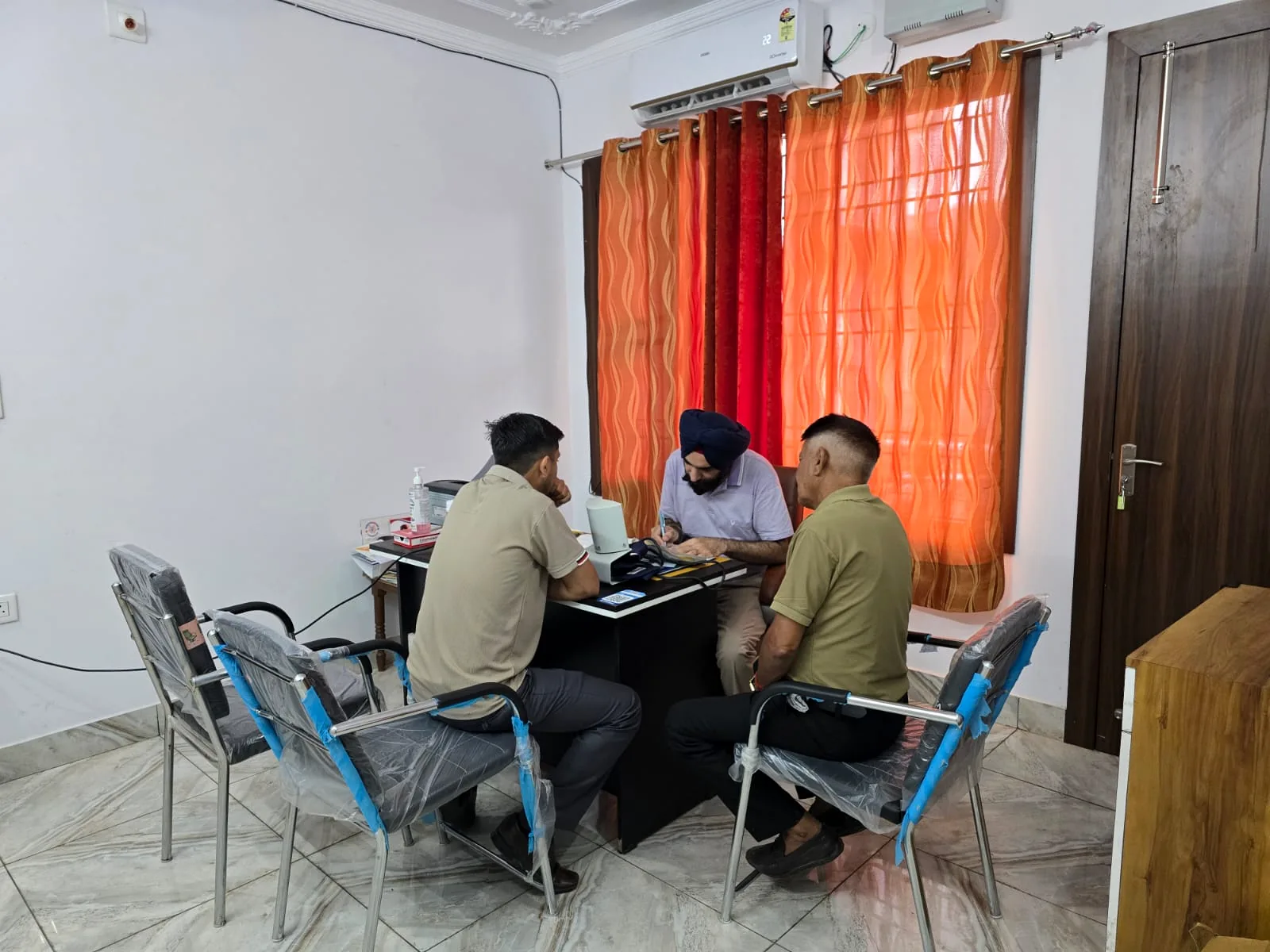 Dr. Ametashver Singh consulting patients at Gandhi Nagar clinic